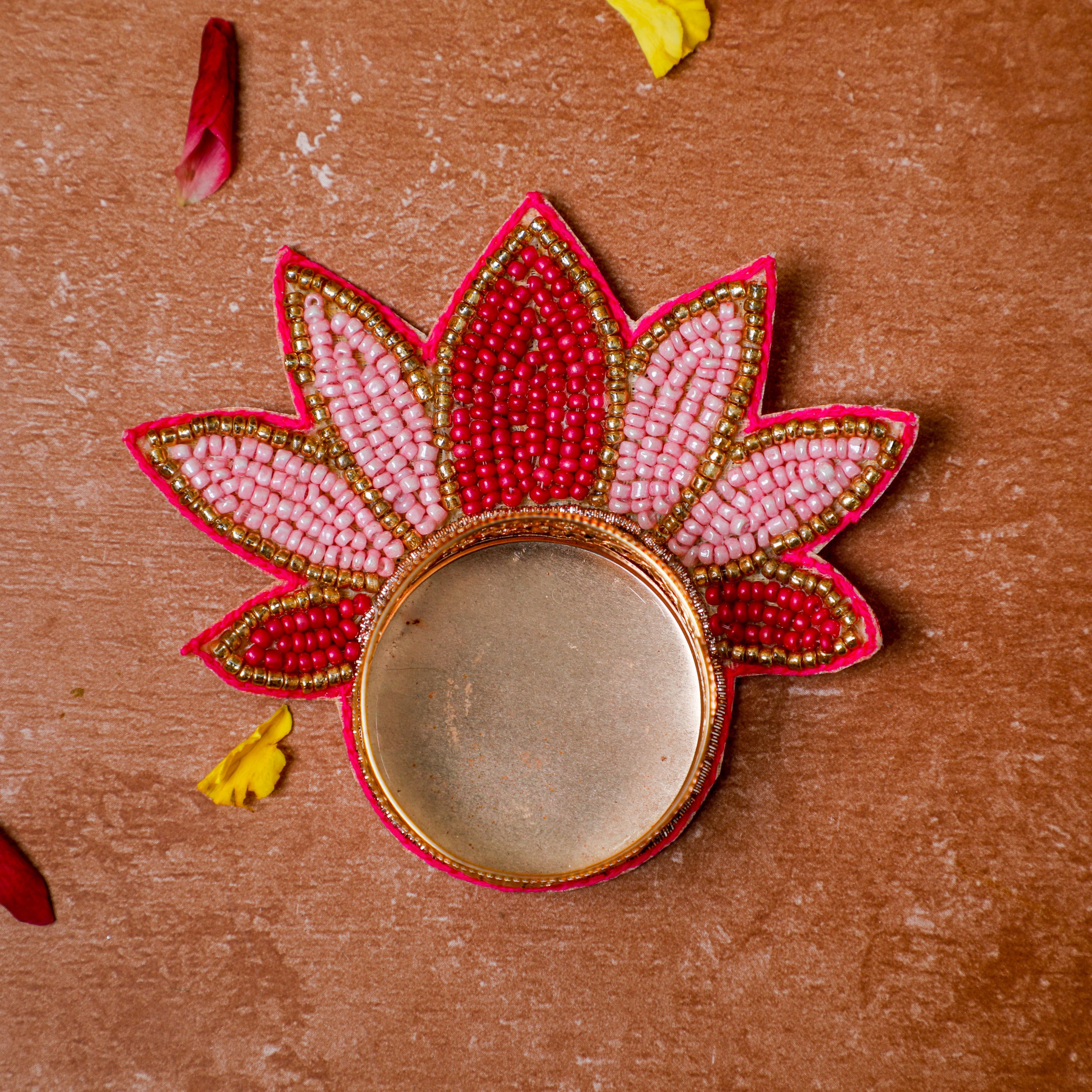 graceful lotus design adorned with an array of vibrant, mini pink beads are meticulously arranged